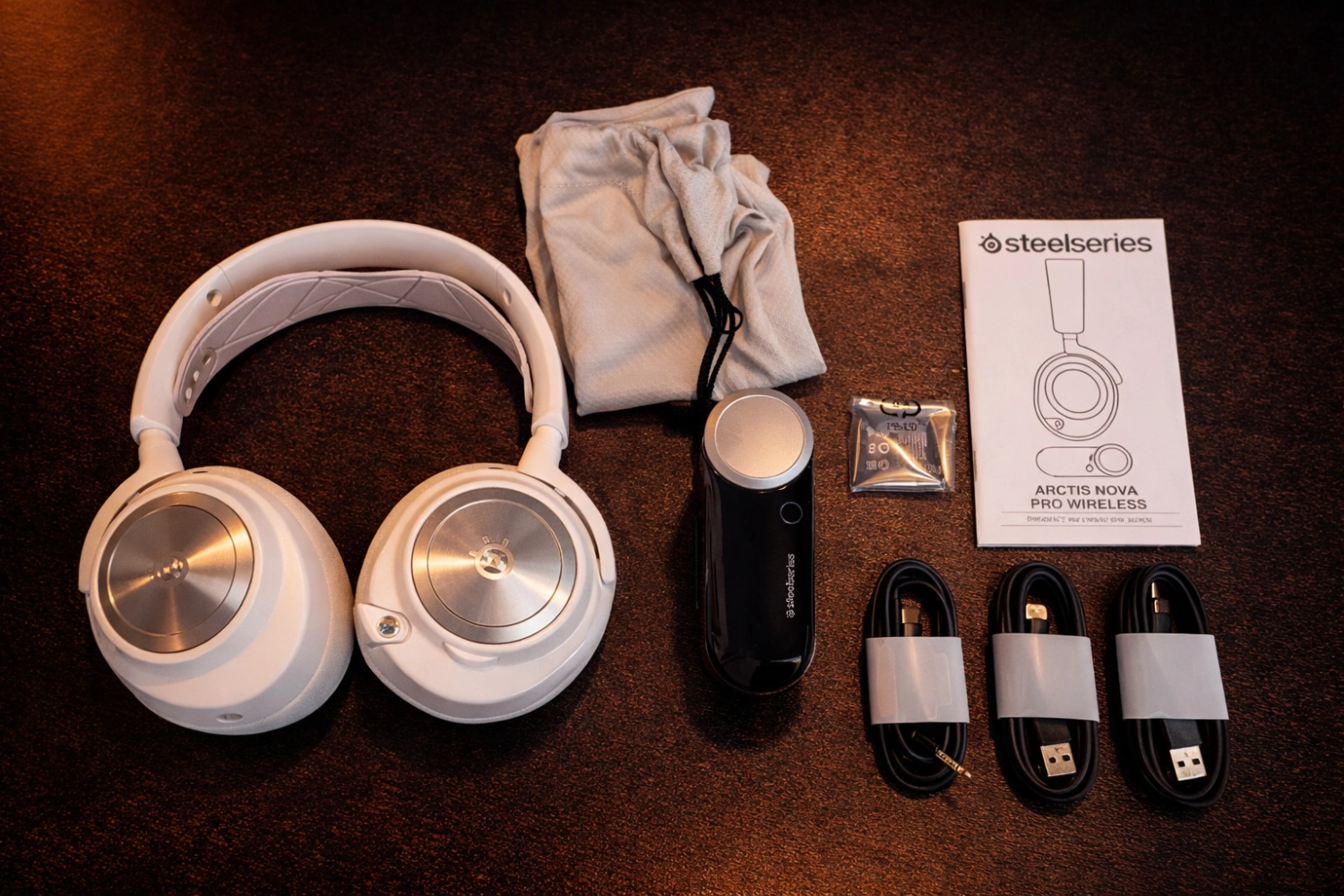 Inside the box, you get everything you need for a complete setup: the headset, wireless base station (GameDAC), two hot-swappable batteries, cables for multiple devices, and all the small extras that make it feel truly premium out of the box.