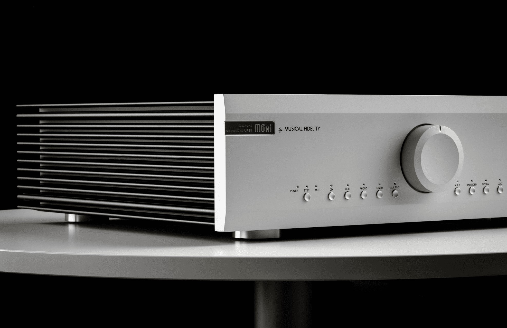 The preamplifier features a pre-out for bi-amping or subwoofer integration and a turntable input that supports both MM and MC cartridges.