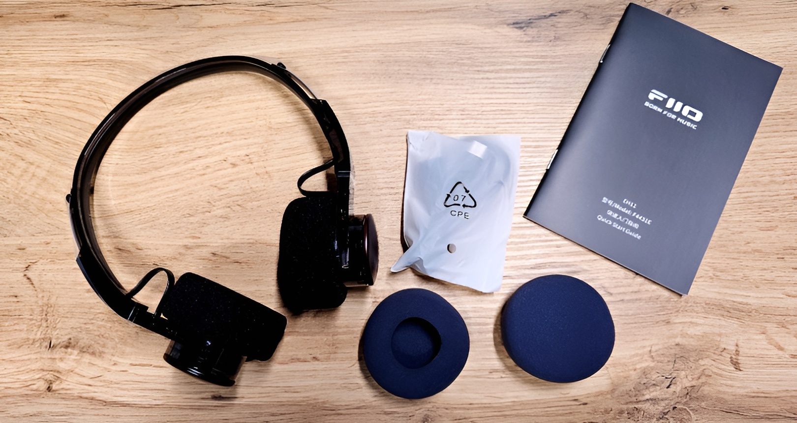 FiiO EH11 Review: Retro Wireless Headphones with LDAC and Surprising Sound 9 Inside the box you'll find the FiiO EH11 headphones, a USB-C charging cable, an extra set of foam ear pads, and documentation to help you get started.