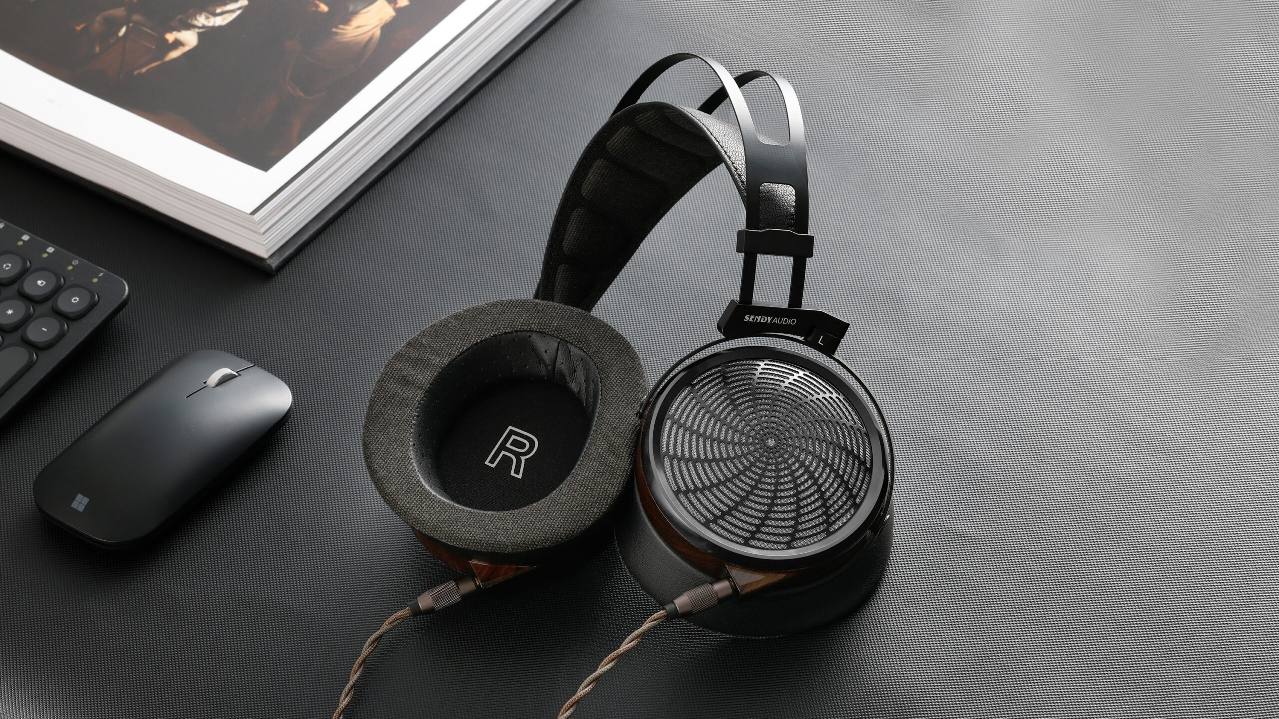 Sendy Audio Apollo PRO: Planar Precision With Lightweight Comfort 9 Handcrafted zebrawood earcups and a distinctive metal grille give the Apollo PRO a premium look that matches its audiophile ambitions.